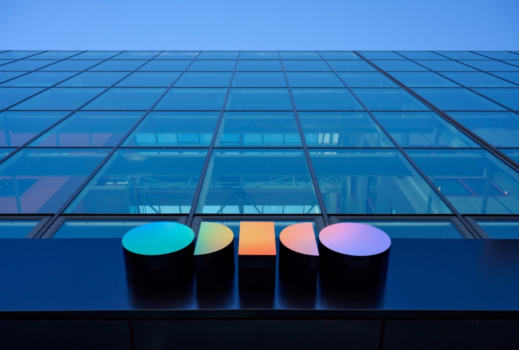 a photo of outside Odido's office, looking up at the building towards the sky