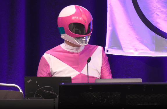 Hacker Martha Root on the stage of the Chaos Communication Congress (39C3) in Hamburg, Germany, an annual cybersecurity conference.
